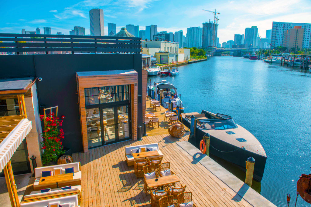 Vista Harbor Residences marina deck with waterfront seating and Miami skyline
